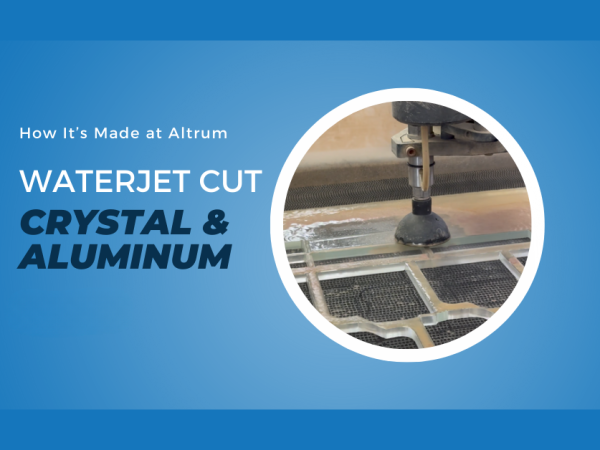 Waterjet-cut crystal and aluminum components showcasing precision-cut materials