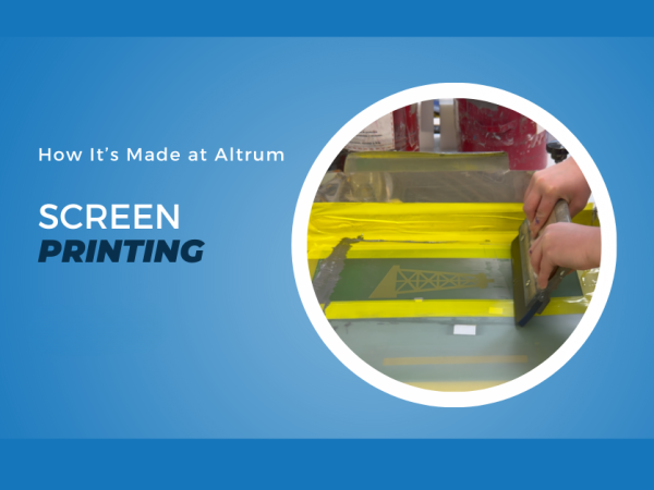 Screen-printing process applying graphics to a custom award component, highlighting Altrum's precision printing capabilities.