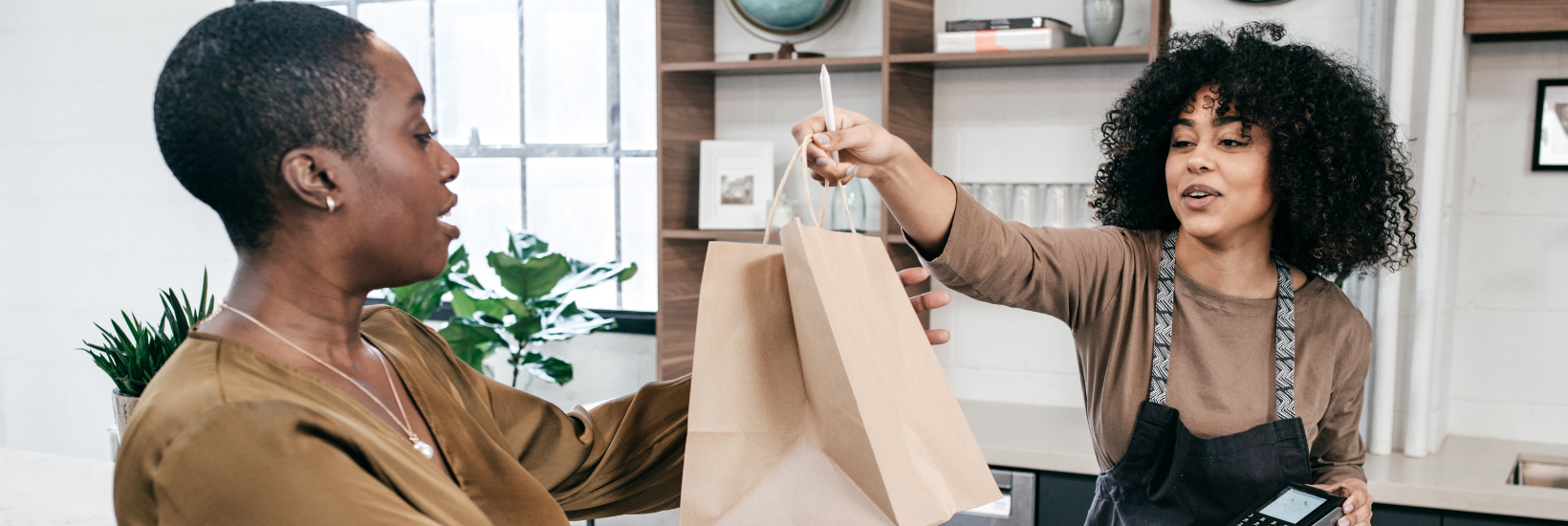 Woman serving a customer in a retail store