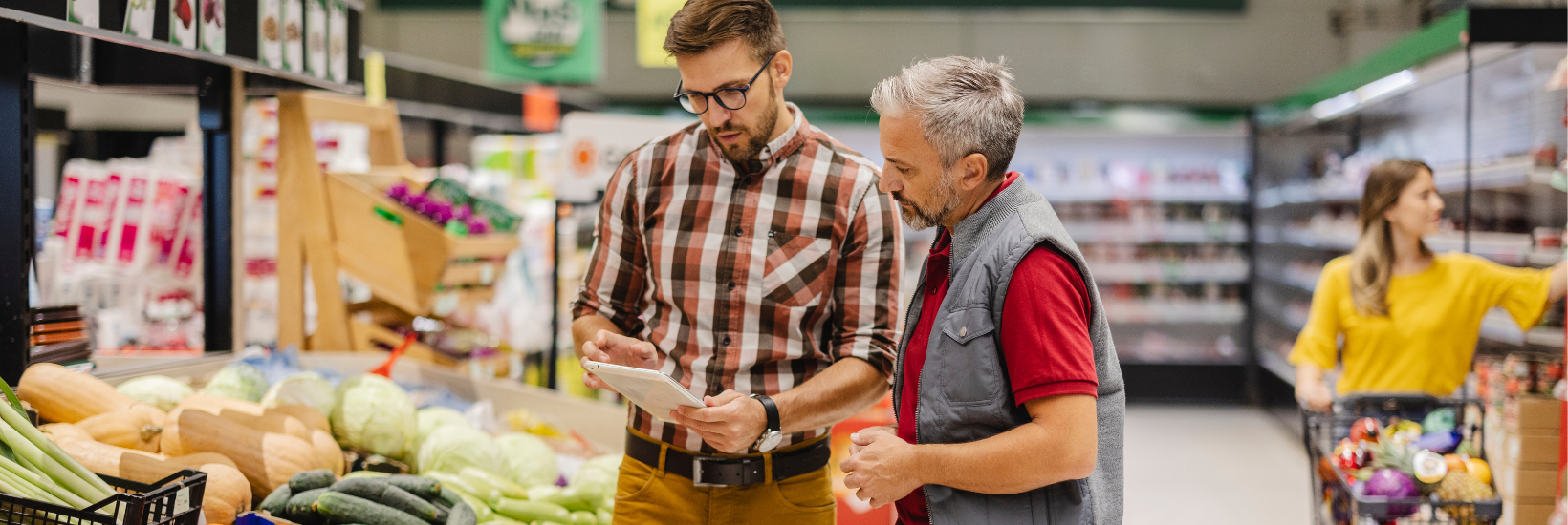 Manager and employee in a groceries store